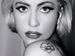 Lady Gaga's heart tattoo with Dad written inside on her left shoulder