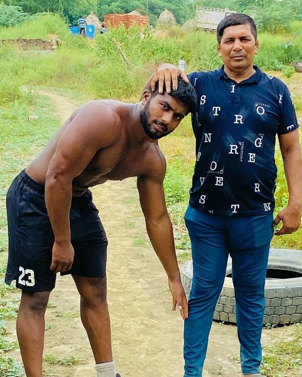 Ankit Baiyanpuria with his coach, Krishan Pahalwan (right)